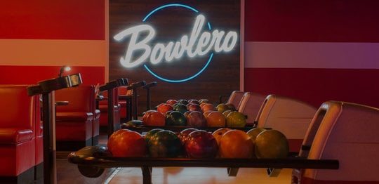 Ball returns with the Bowlero logo glowing in the background
