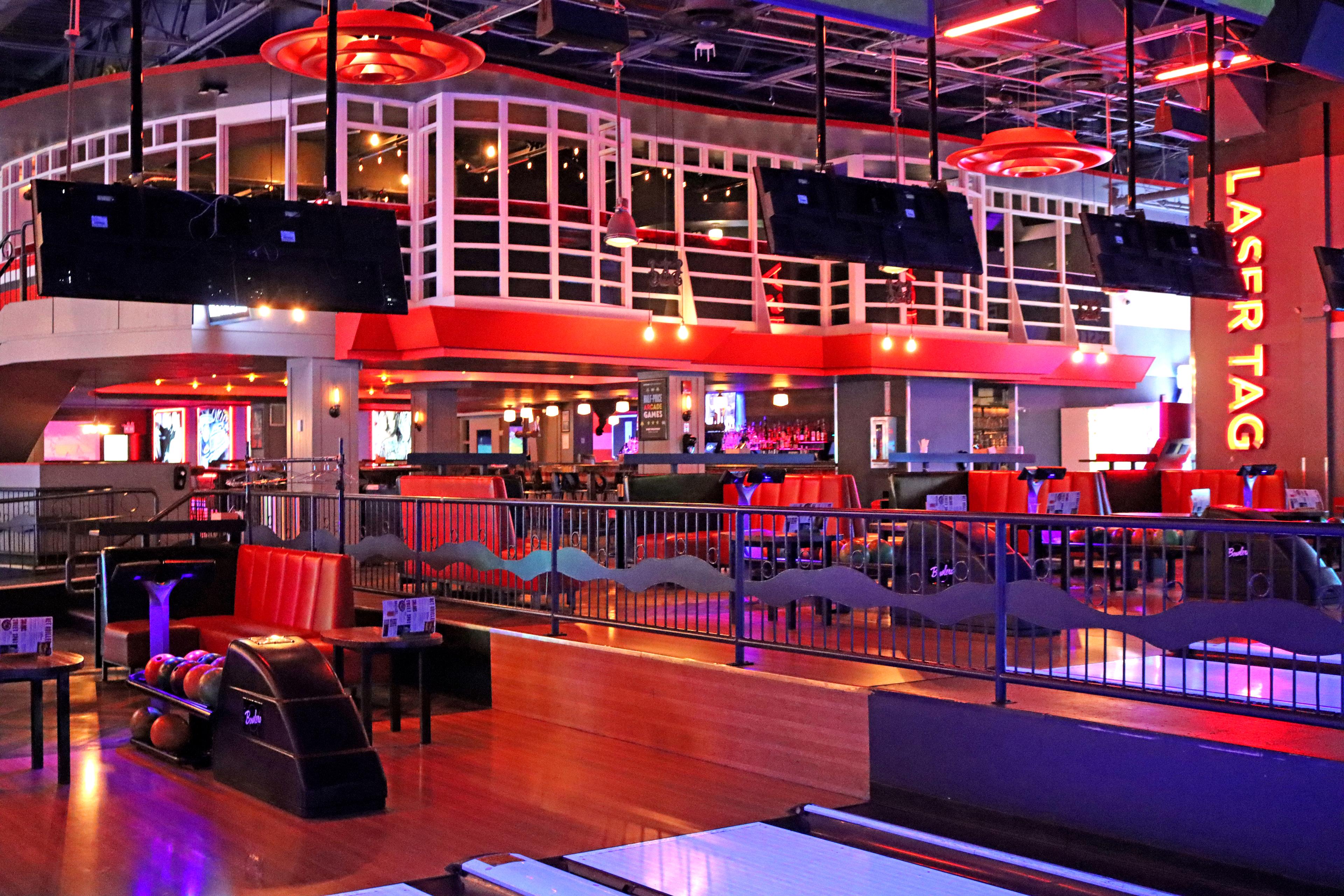 Inside of Bowlero Chelsea Piers with lanes and seating. 