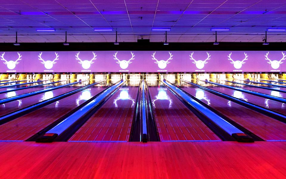 Bowling lanes with Bowlero signs