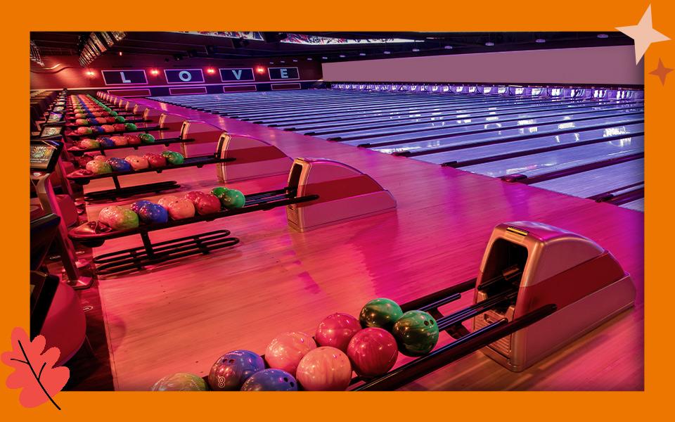 Colorful bowling balls in front of bowling lanes