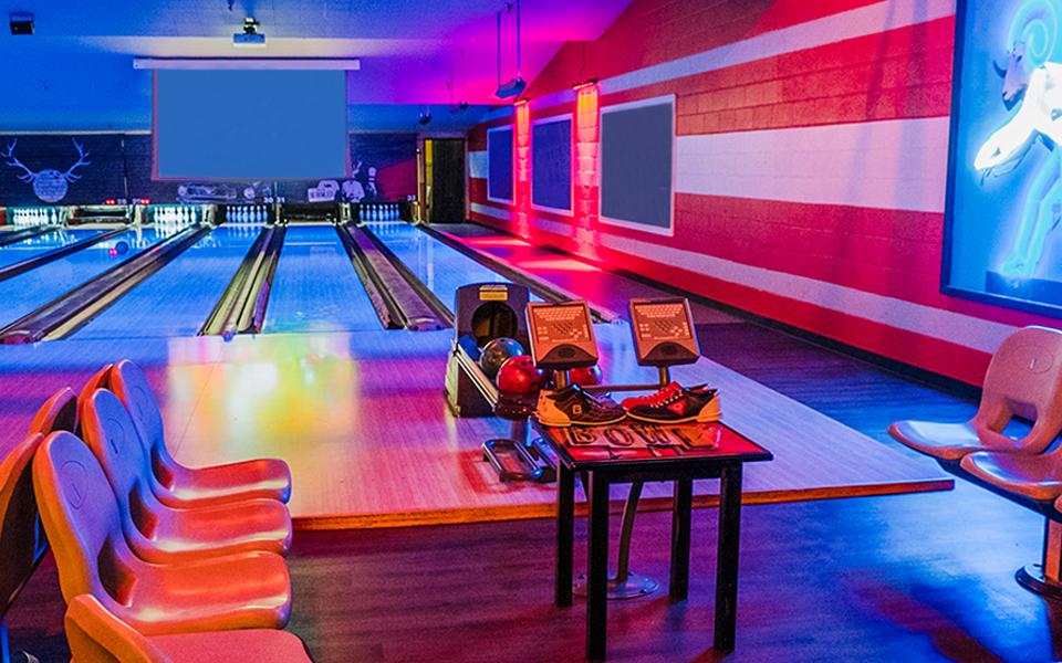 Bowling lane chairs with bowling lanes in the background