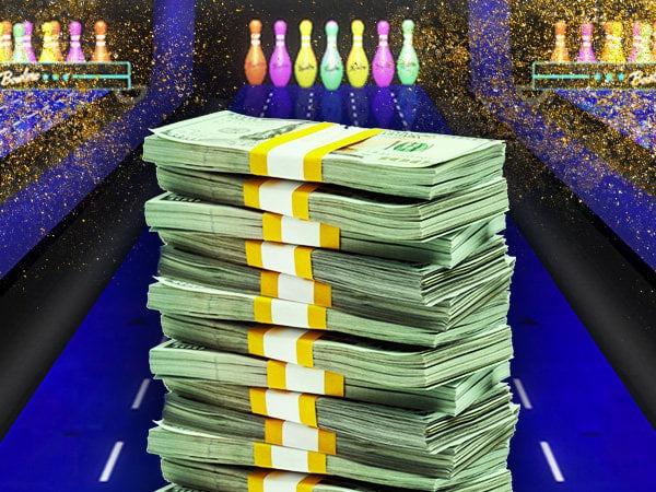 Stack of cash in front of bowling lane