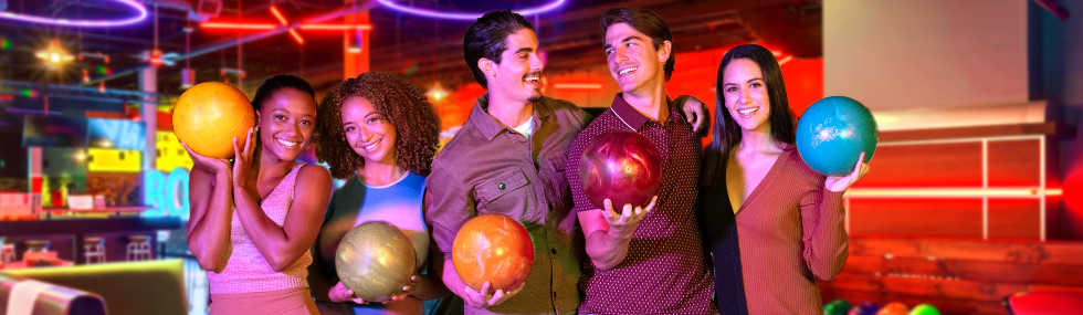 Group of 5 people getting ready to bowl and having fun